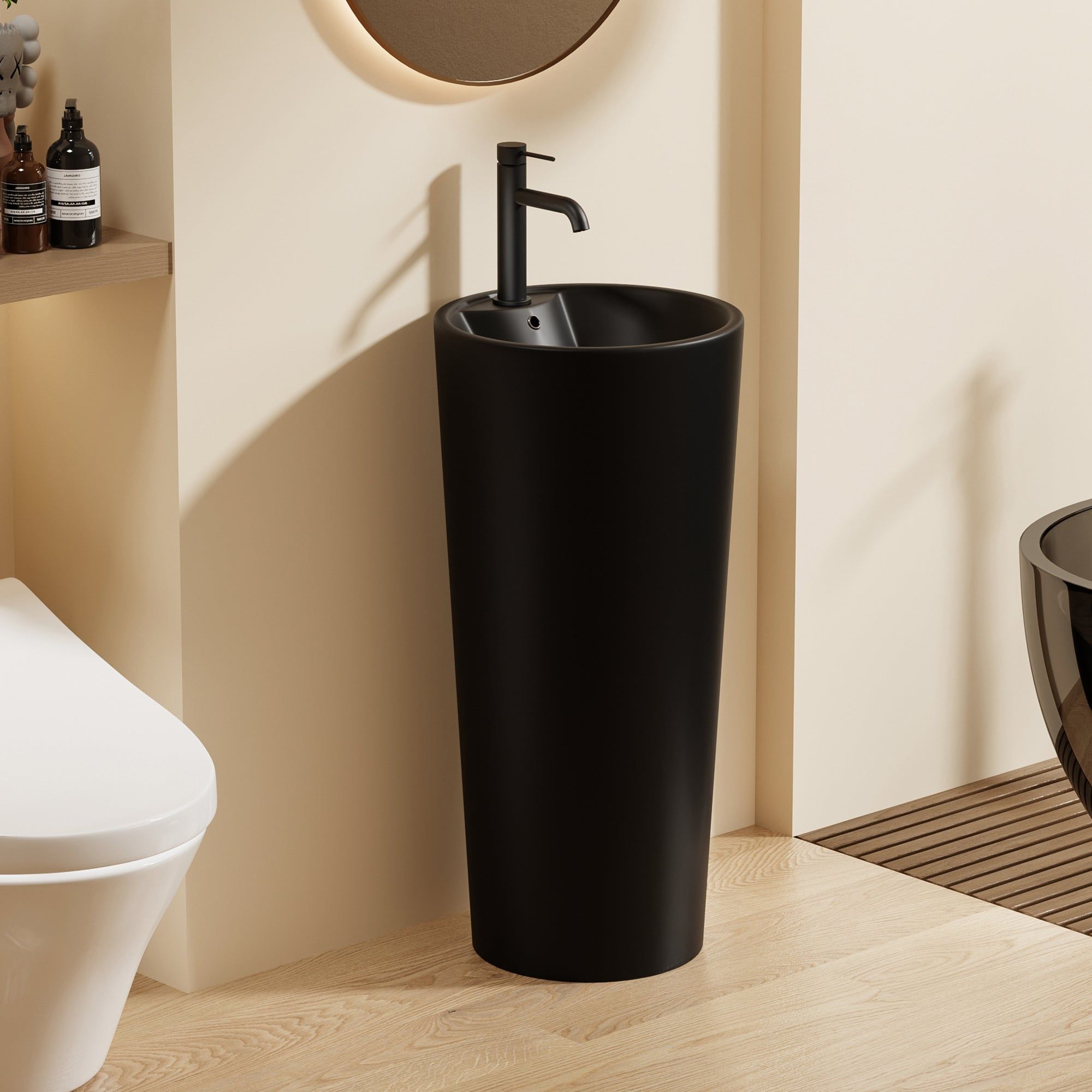 Lavabo Totem Design Rond et Épuré Noir : Lavabo sur colonne noir élégant au design rond et moderne. Idéal pour les salles de bains contemporaines.