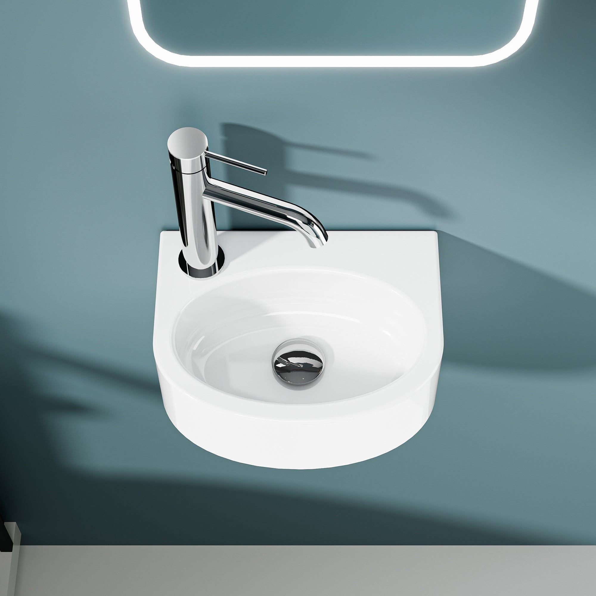 Vestino lave-mains mural blanc en céramique avec robinet chromé.