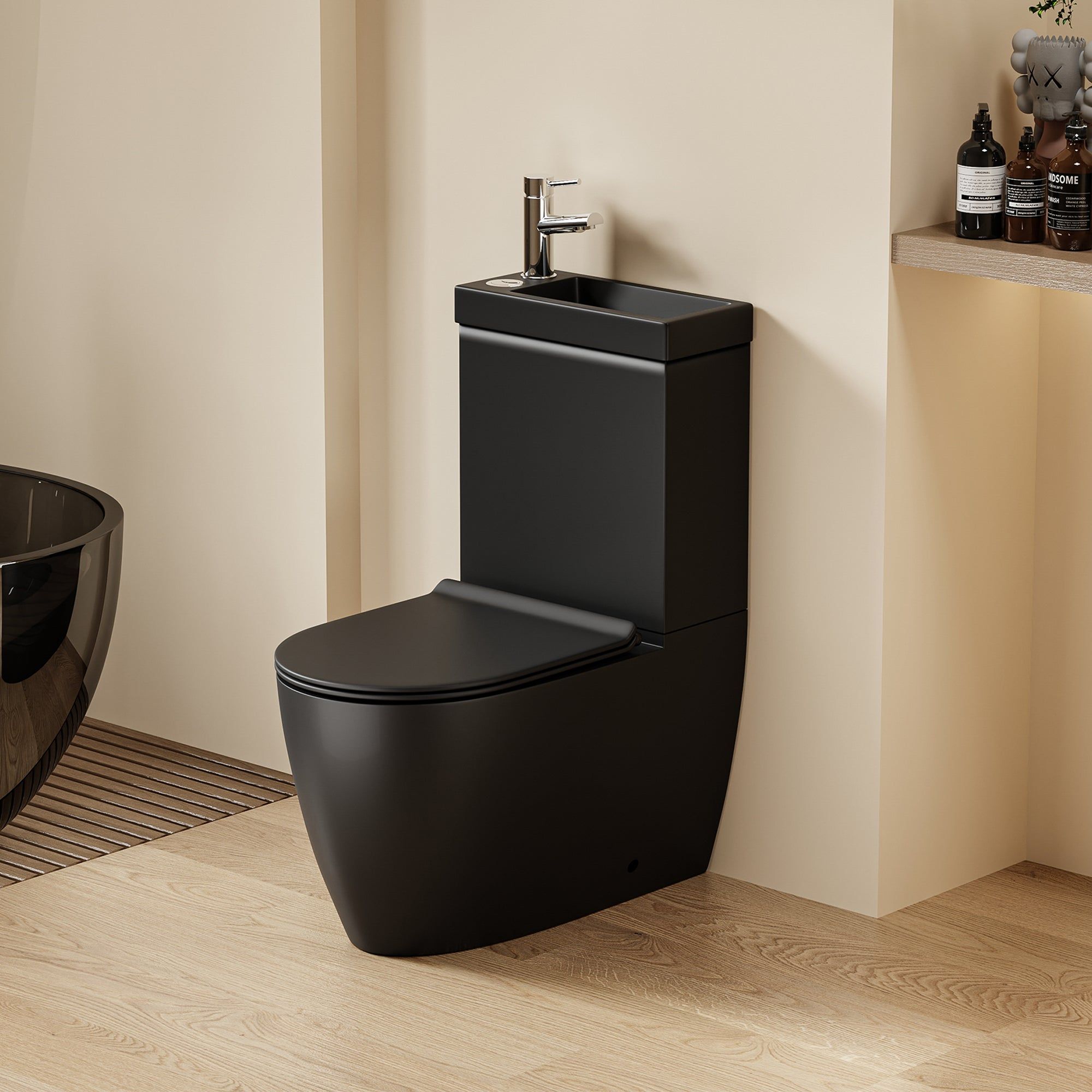 WC 2 en 1 Noir : Ensemble WC noir moderne et lavabo intégré au design arrondi et robinet chromé.