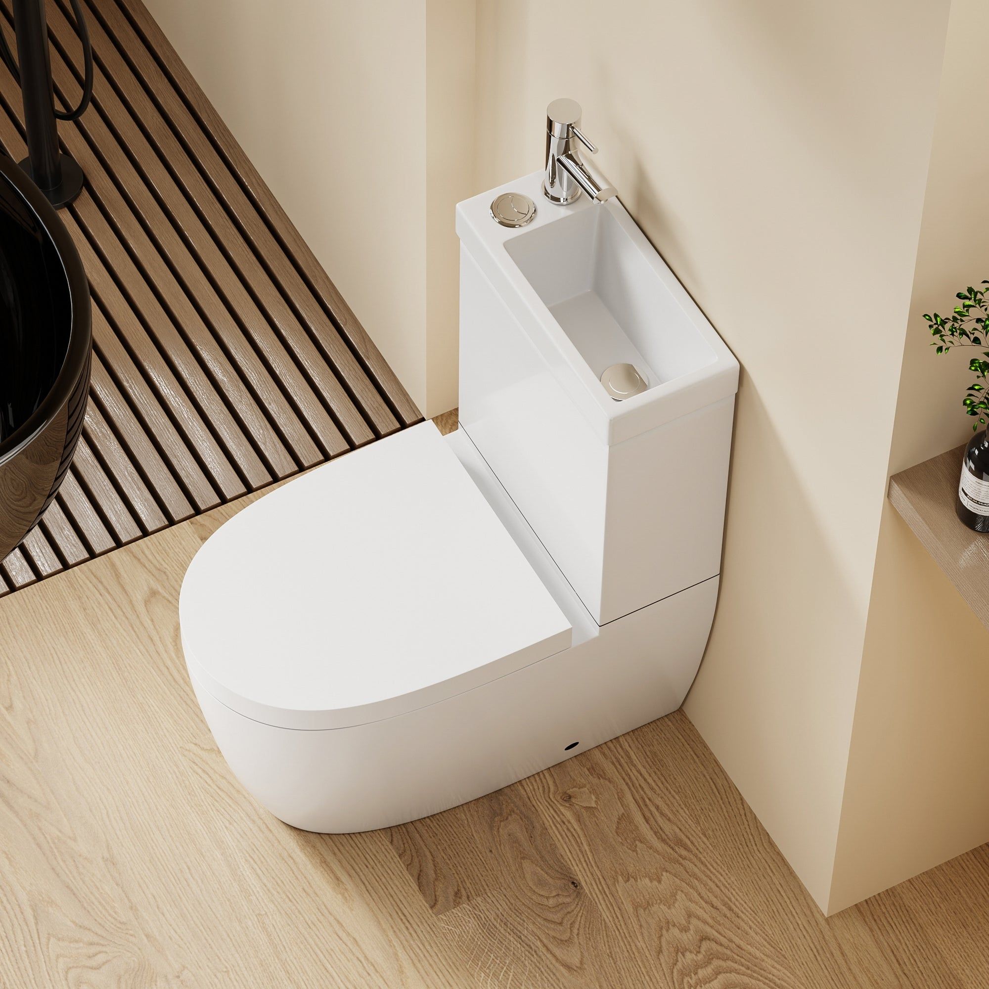 WC 2 en 1 Blanc : Ensemble WC et lavabo blanc peu encombrant avec un design arrondi et un robinet chromé.