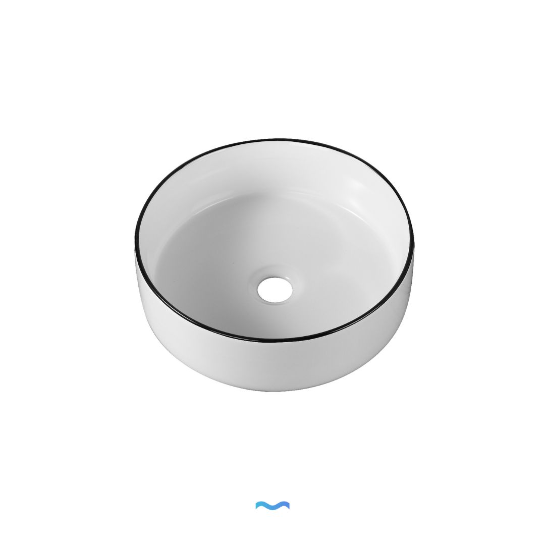 Vasque ronde en céramique blanche avec rebord noir. Idéale pour les salles de bains modernes.