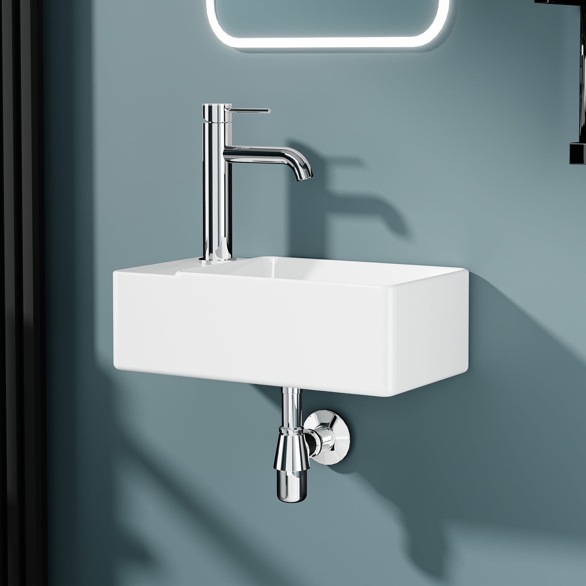 Vasque lave-mains rectangulaire blanc 40x22 cm, installation murale avec robinetterie chromée.