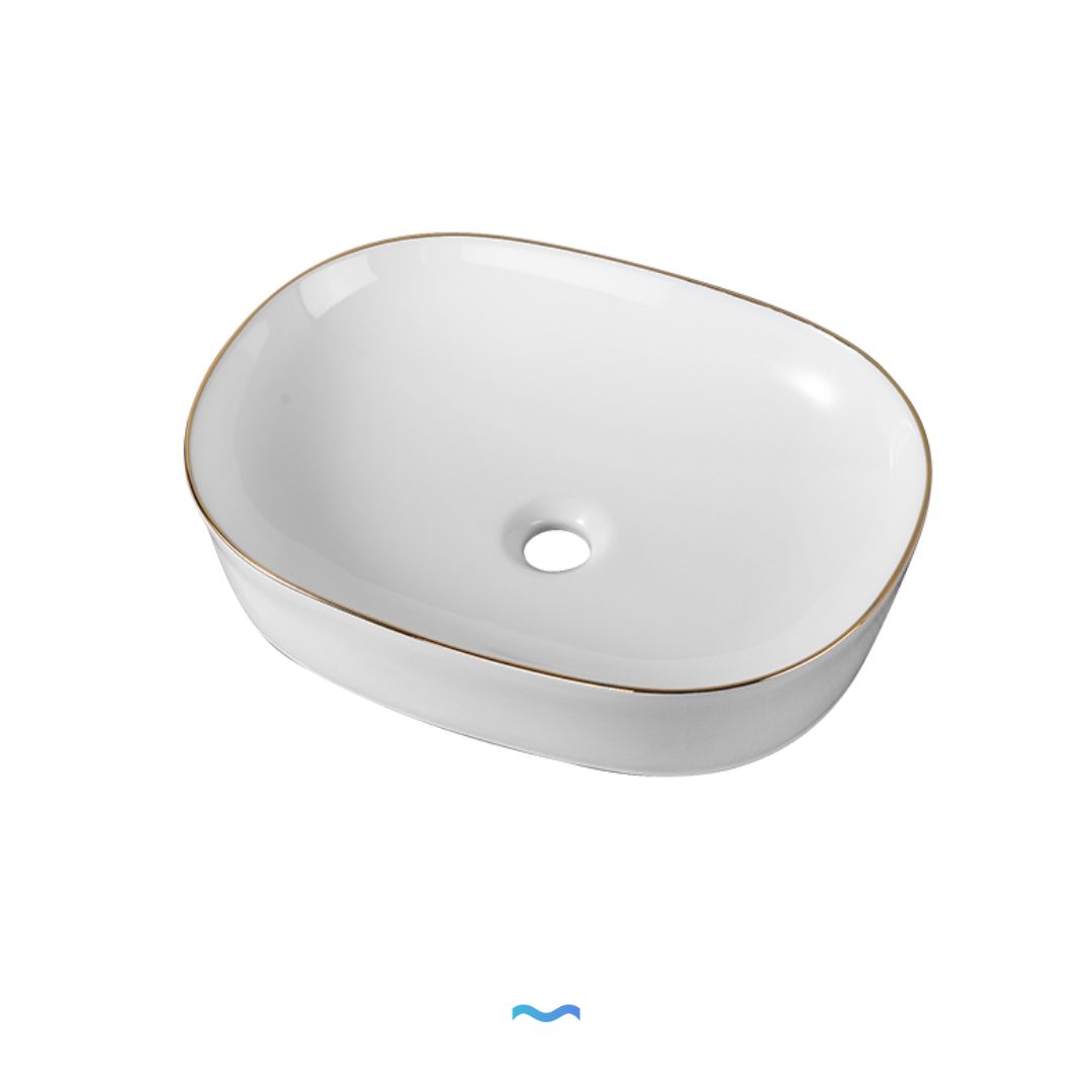 Vasque ovale en céramique avec garniture dorée