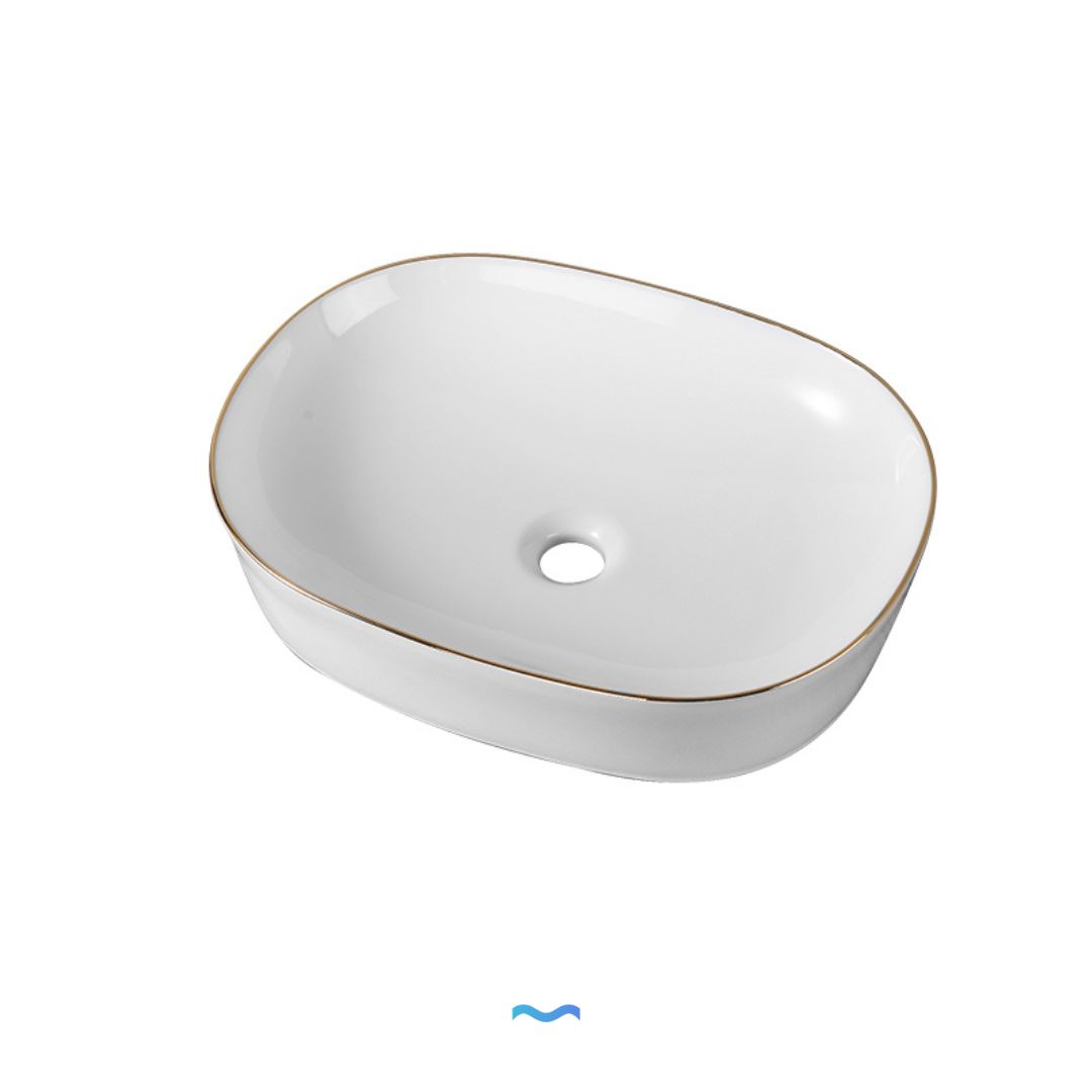 Vasque ovale en céramique avec garniture dorée