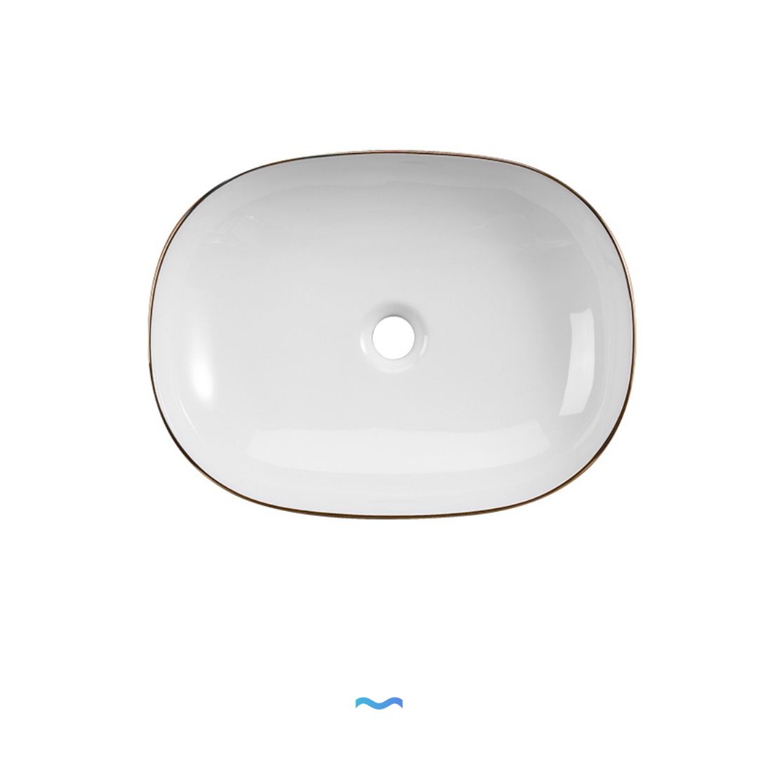 Vasque ovale en céramique avec garniture dorée