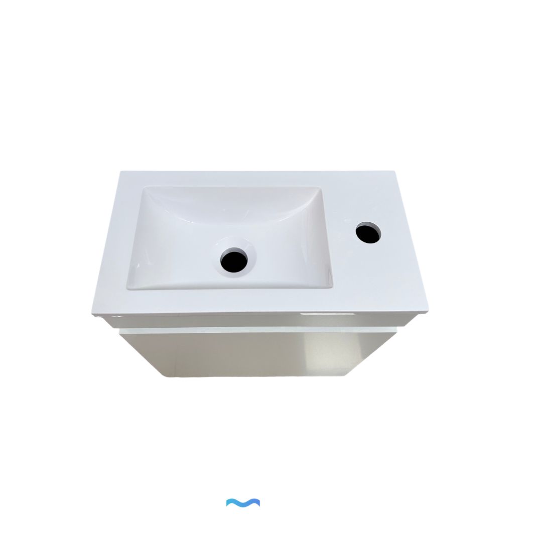 Meuble de salle de bain compact blanc avec lavabo intégré