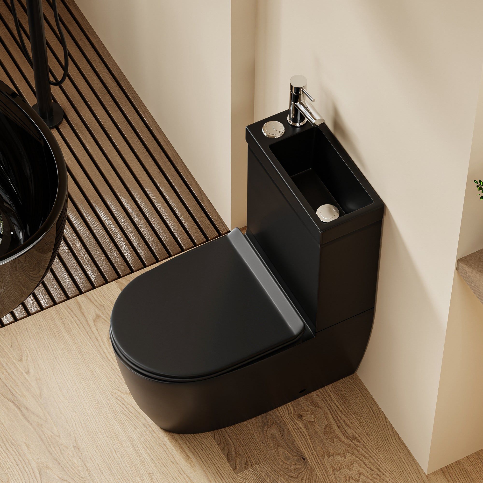 WC 2 en 1 Noir : WC noir peu encombrant et meuble vasque intégré au design épuré et arrondi et robinet chromé.