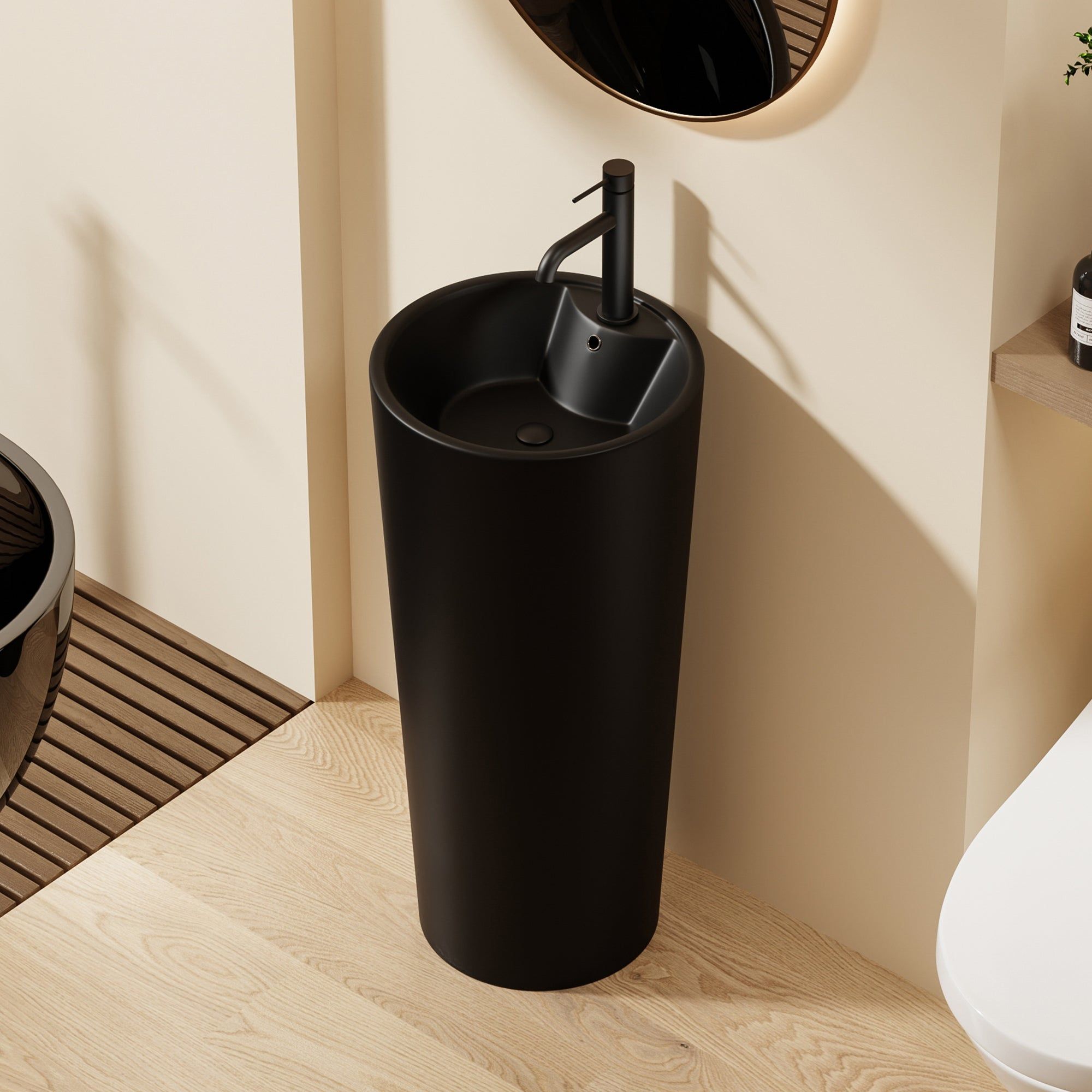 Lavabo Totem Design Rond et Épuré Noir: Sleek black pedestal sink with modern round basin and minimalist faucet.
