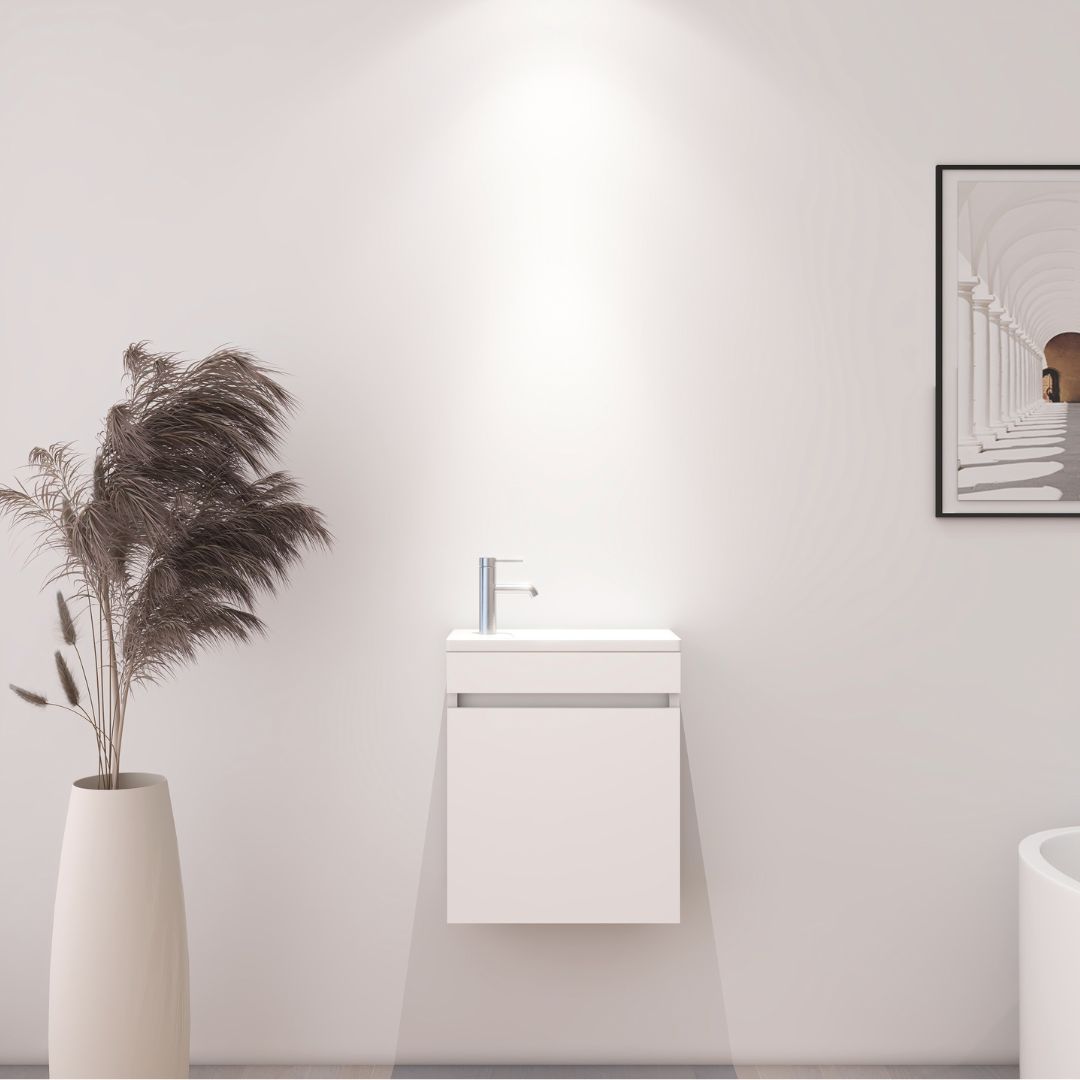 Meuble de salle de bain compact blanc avec lavabo intégré