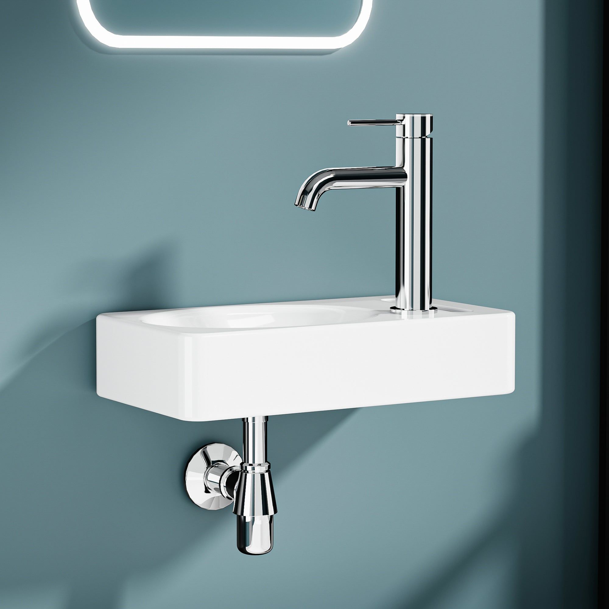Lavabo mural blanc avec robinet en chrome et porte-serviette intégré, dimensions 39,5*22 cm.