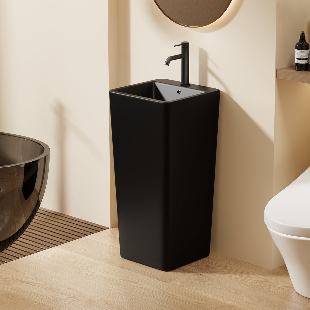 Lavabo Totem noir Carré arrondie : Lavabo de salle de bain moderne noir sur pied avec une vasque carrée et des coins arrondis.