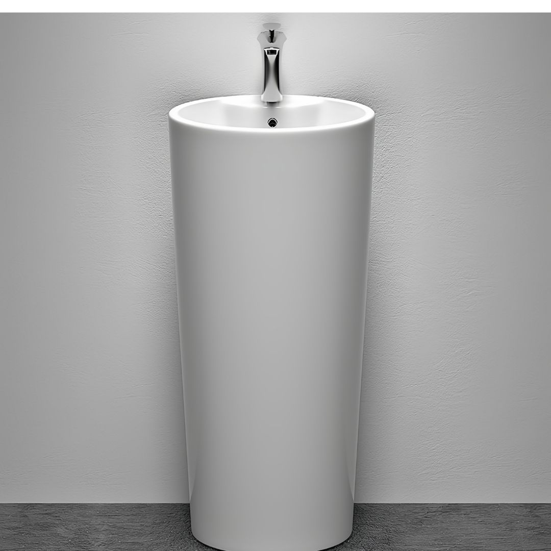 Lavabo Totem Design Arrondi et Épuré Blanc: Elegant white cylindrical pedestal sink with a modern, minimalist design.