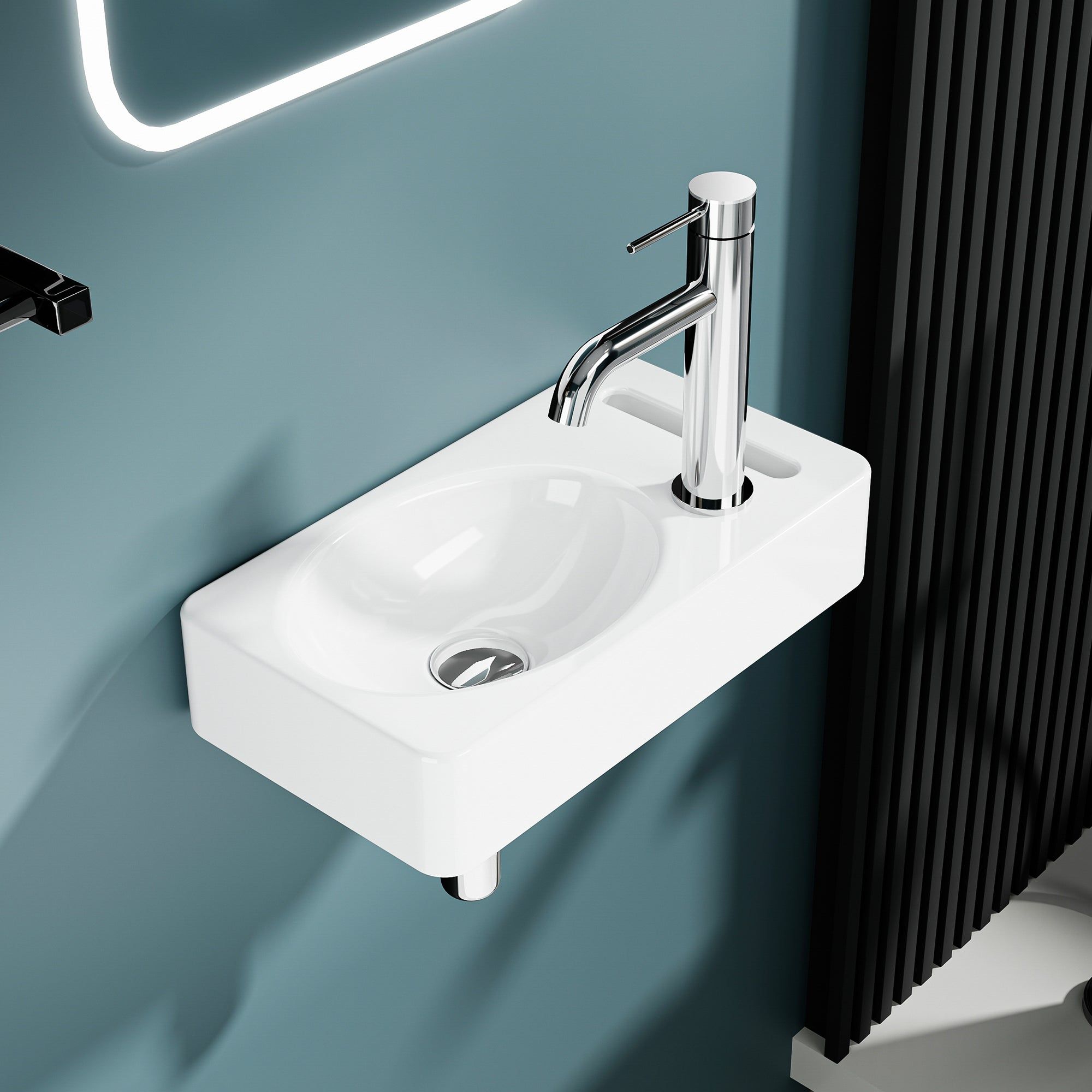 Lave-mains mural blanc avec robinet intégré et porte-serviette sur le côté.