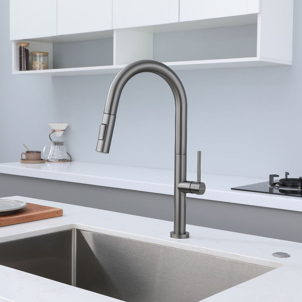 Metallic gray pull-down kitchen faucet with high arc spout and single lever handle.  Robinet de cuisine avec Douchette Extractible gris metallique
