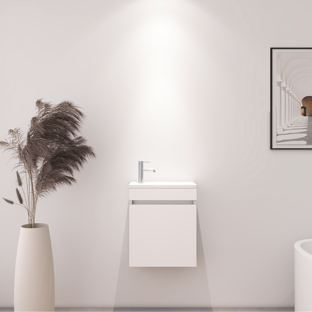 Meuble de salle de bain compact blanc avec lavabo intégré
